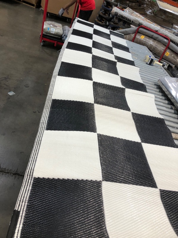 Photo 1 of **USED - NEEDS CLEANING**
7FT X 11 FT CHECKERED RUG 