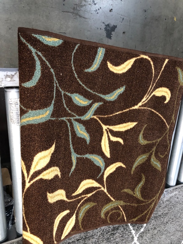 Photo 1 of **USED**
3  X 7 BROWN RUG WITH BLUE-YELLOW DESIGN 