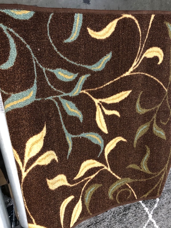 Photo 1 of **USED**
3  X 7 BROWN RUG WITH BLUE-YELLOW DESIGN 