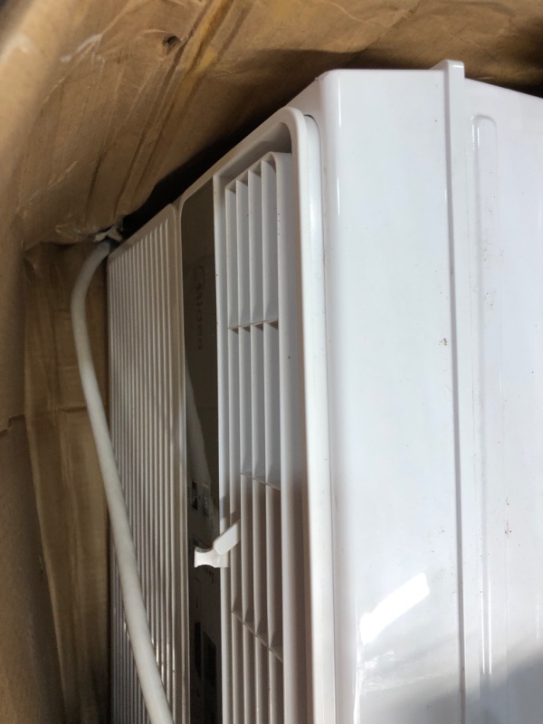 Photo 4 of **USED- MAJOR DAMAGED*DIRTY INSIDE**
Midea MAW12R1BWT 12,000 BTU 115V Window AC W/Remote
