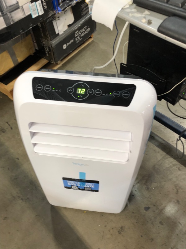 Photo 6 of **MISSING 1 WHEEL**
SereneLife SLPAC12.5 Portable Air Conditioner Compact Home AC Cooling Unit with Built-in Dehumidifier & Fan Modes, Quiet Operation, Includes Window Mount Kit, 12,000 BTU, White
