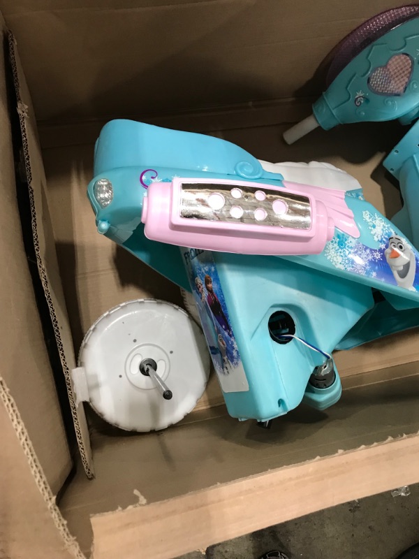 Photo 8 of **used-minor damage****
Kid Trax Disney Frozen Kids Scooter Ride On Toy, 6 Volt, Kids 3-5 Years Old, Max Weight 55 lbs, Single Rider, Battery and Charger Included, Blue
