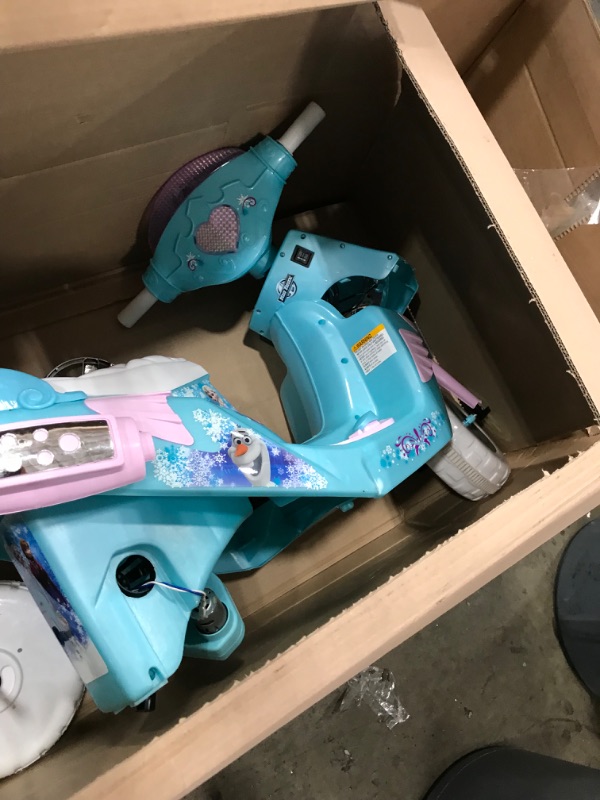 Photo 4 of **used-minor damage****
Kid Trax Disney Frozen Kids Scooter Ride On Toy, 6 Volt, Kids 3-5 Years Old, Max Weight 55 lbs, Single Rider, Battery and Charger Included, Blue
