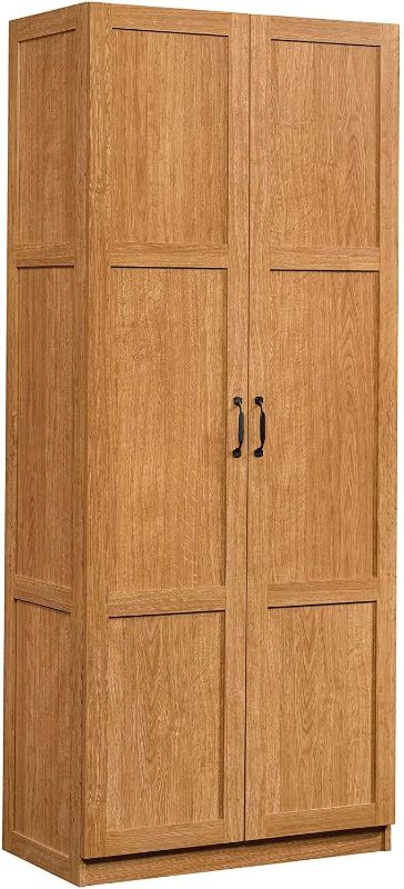 Photo 1 of **USED-MINOR WOOD DAMAGE**
Sauder Storage Cabinet, Highland Oak Finish
