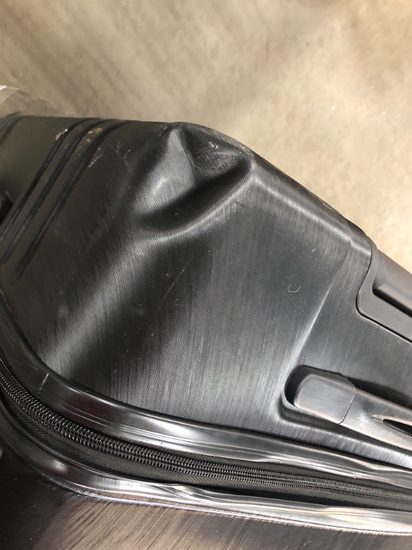 Photo 3 of **BROKEN WHEEL**
 U.S. Traveler Boren Polycarbonate Hardside Rugged Travel Suitcase Luggage with 8 Spinner Wheels, Aluminum Handle, Black, Checked-Large 30-Inch
