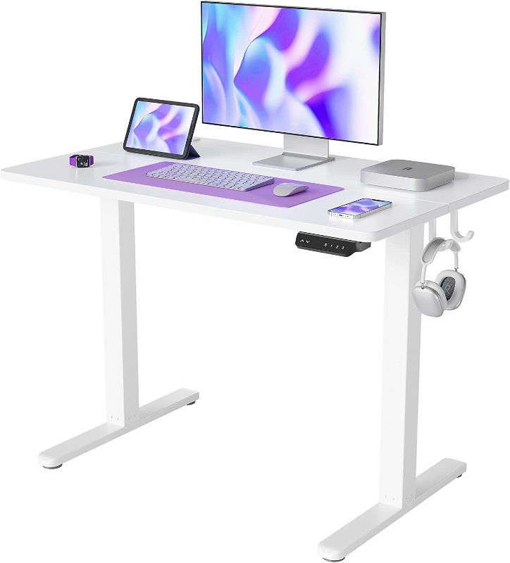 Photo 1 of FEZIBO Height Adjustable Electric Standing Desk, 40 x 24 Inches Stand Up Table, Sit Stand Home Office Desk with Splice Board, White Frame/White Top
