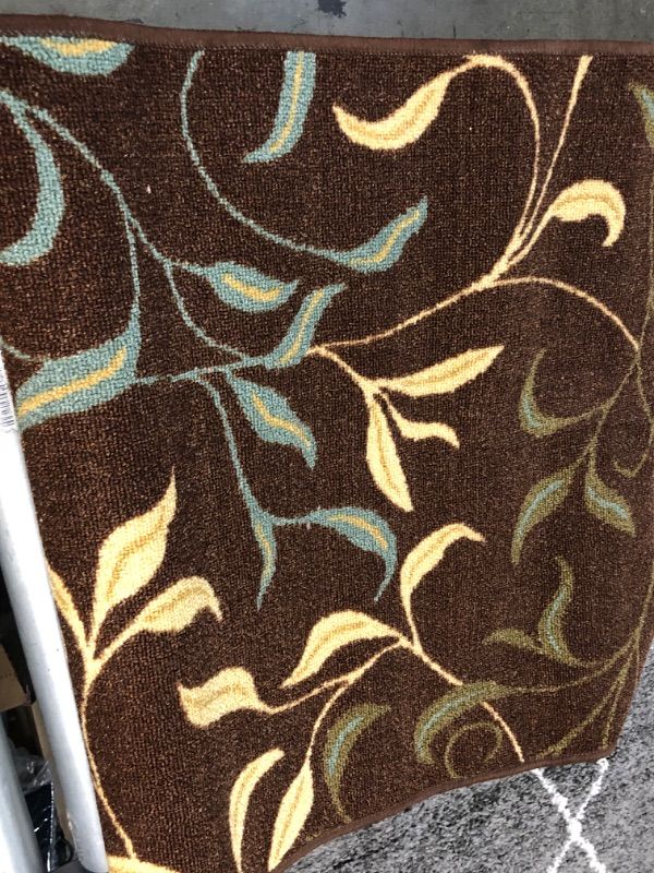 Photo 1 of **USED** 3 X 7 BROWN RUG WITH BLUE-YELLOW AND GREEN  DESIGN
