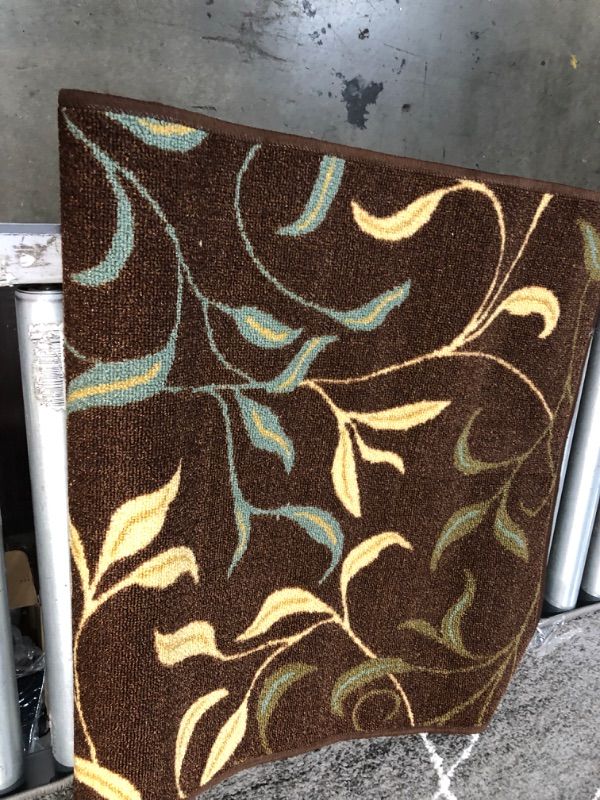 Photo 3 of **USED** 3 X 7 BROWN RUG WITH BLUE-YELLOW AND GREEN  DESIGN

