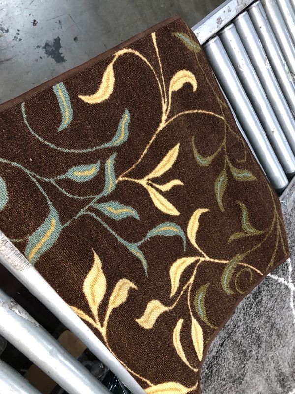 Photo 2 of **USED** 3 X 7 BROWN RUG WITH BLUE-YELLOW AND GREEN  DESIGN

