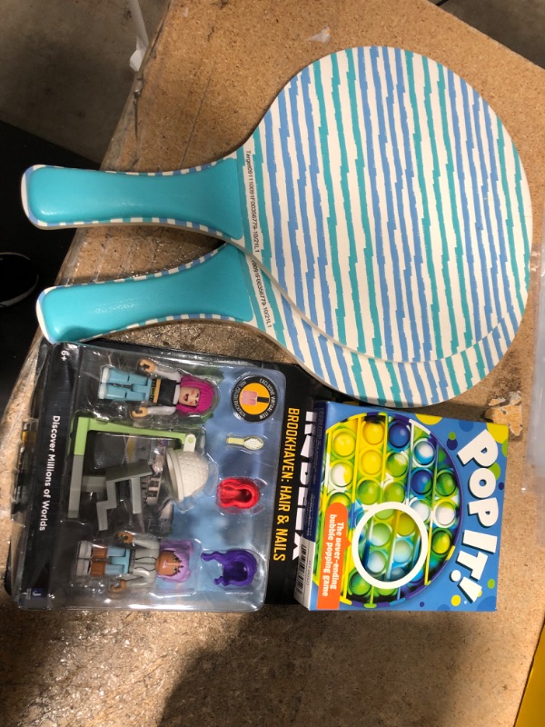 Photo 1 of Bundle of Blue Stripes Paddles, Jazwares Roblox Brookhaven: Hair and Nails Game Pack, AND Chuckle & Roar Pop It! Blue-Green Tie Dye