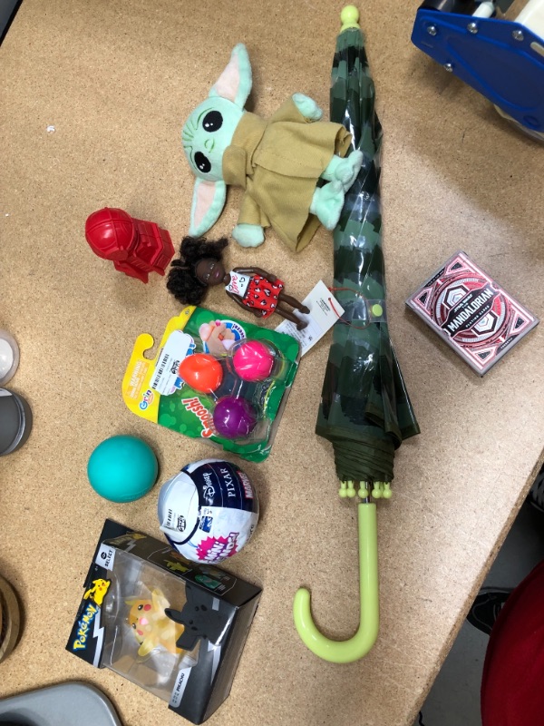 Photo 1 of bundle of 9 kids toys 
umbrella, Mandalorian playing cards and ect..  