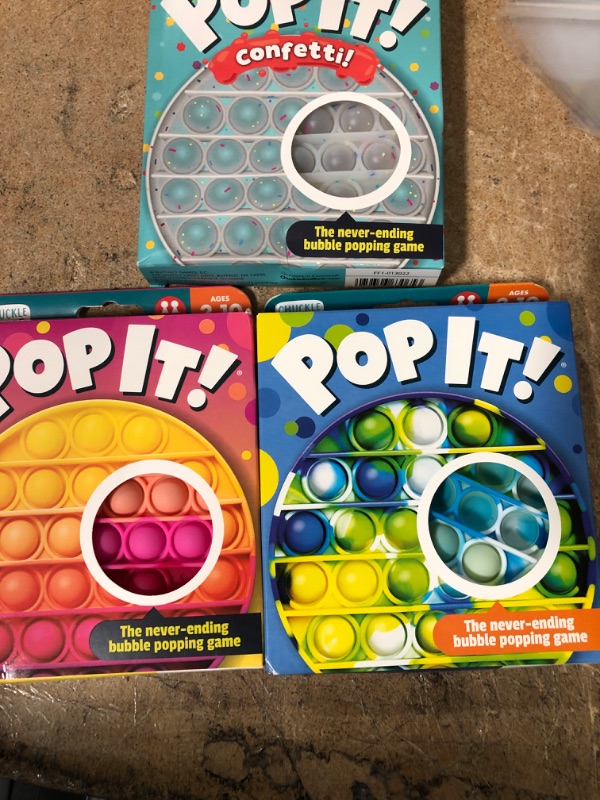 Photo 1 of BUNDLE OF ( 3 ITEMS) Chuckle & Roar Pop It! Blue-Green Tie Dye Bubble Popping and Sensory Game
