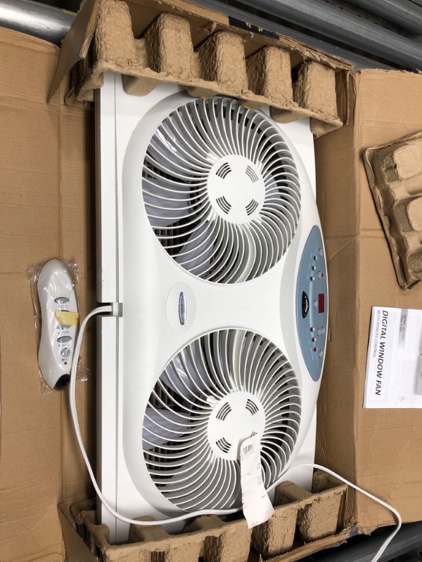 Photo 2 of Bionaire Window Fan with Twin 8.5-Inch Reversible Airflow Blades and Remote Control, White & Holmes Dual 8" Blade Twin Window Fan with Manual Controls, 3 Speed Settings, White
