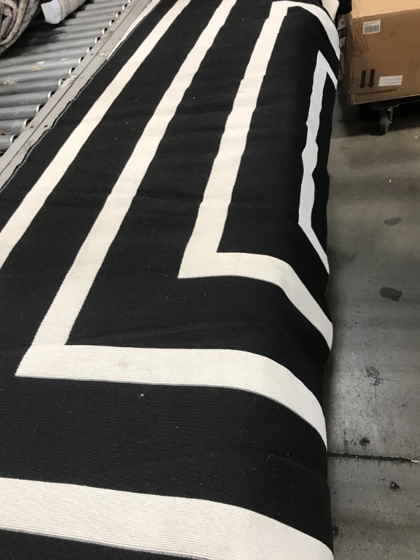 Photo 1 of 76X30IN BLACK AND WHITE PATTERNED RUG