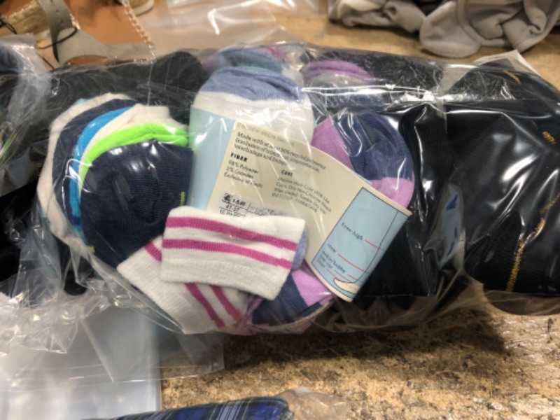Photo 1 of family bundle of assorted sized socks  30+pairs