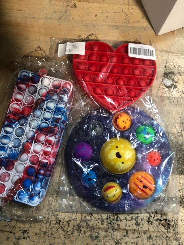 Photo 1 of BUNDLE OF ( 3 ITEMS) POPIT HAND BAG& HEART & SOLAR SYSTEM 