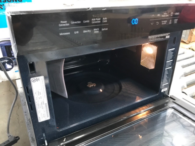 Photo 5 of **CENTER OF GLASS DAMAGED** Samsung MC12J8035CT Convection Microwave, 1.2 cu. ft, Black
