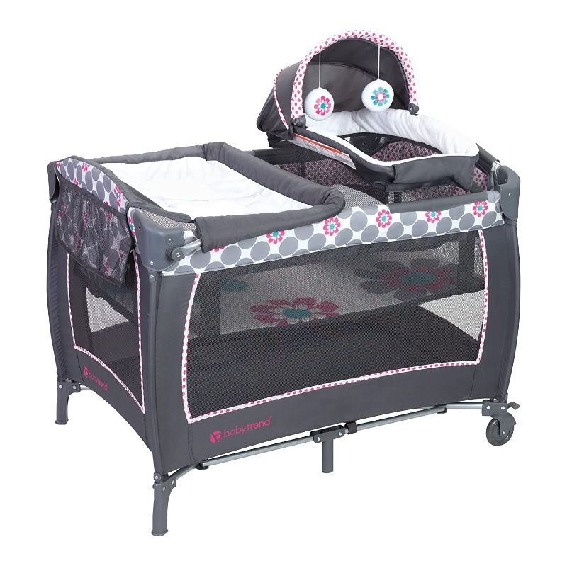 Photo 1 of Baby Trend Lil Snooze Deluxe II Nursery Center Playard with Bassinet and Travel Bag - Daisy Dots
