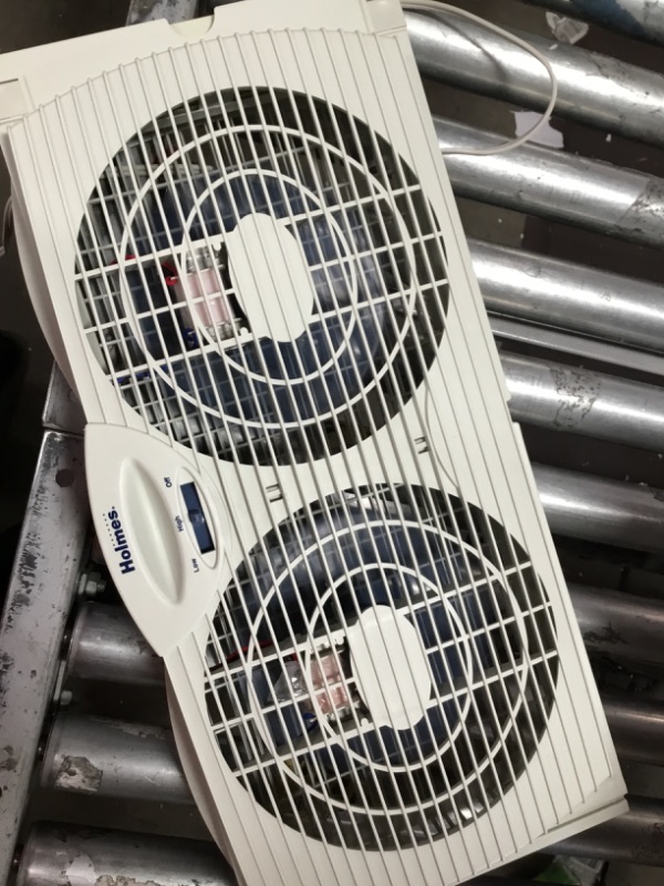 Photo 3 of Holmes Dual Blade Manual Window Fan with Reversible Air Flow
