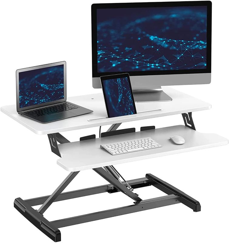 Photo 1 of **MINOR DAMAGE** ATUMTEK Standing Desk Converter, 32 Inch Height Adjustable Sit to Stand Desk Riser, Home Office Dual Monitor and Laptop Tabletop Workstation with Wide Keyboard Tray, White
