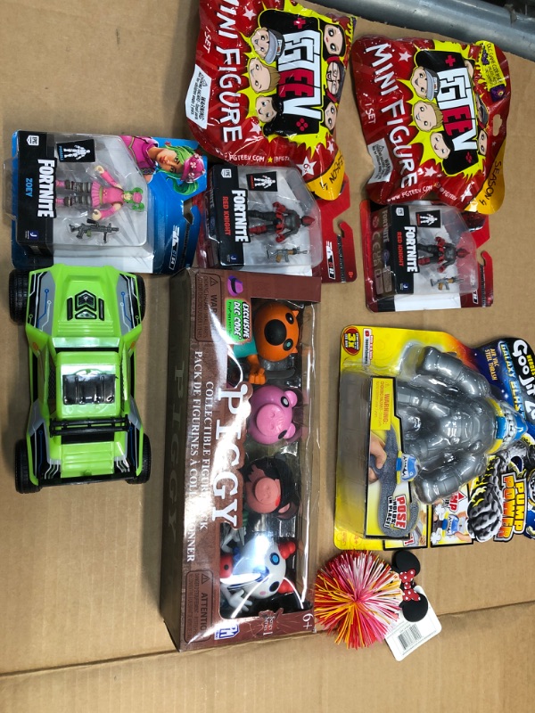 Photo 1 of Bundle of 8- assorted toys- piggy, fortnite, etc. 