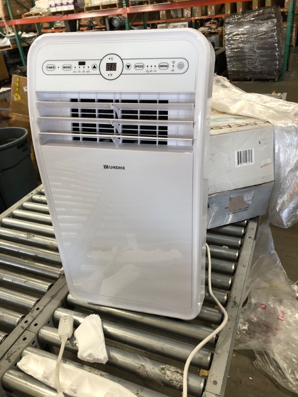 Photo 2 of Ukoke 12,000 BTU (7,000 BTU, DOE) Wi-Fi Portable Air Conditioner with Heat, Dehumidifier in White, Works with Alexa DOES NOT TURN ON, SOLD FOR PARTS 
