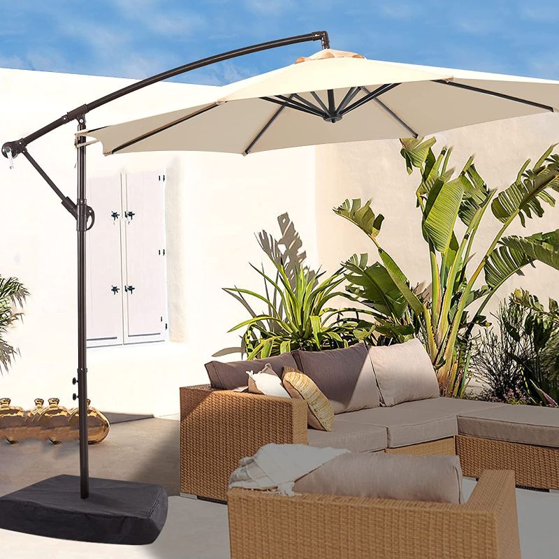 Photo 1 of **WEIGHTED BASE SOLD SEPERATELY**
LE CONTE 10ft Patio Umbrella with Base Included, Outdoor Offset Cantilever Umbrella with Fade Resistant POLYESTER DTY Canopy Infinite Tilt, Crank & Cross Base (Beige)
