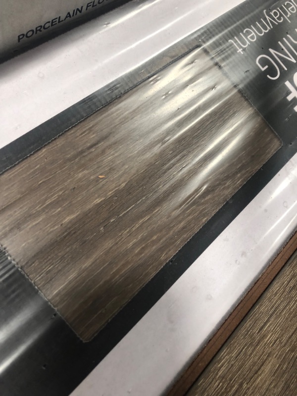 Photo 1 of SOLD AS PALLET OF 12 CASES- Surfaces Trinity Mocha Waterproof Laminate Wood Flooring 10 mm T x 7.7 in. W x 47.87 in. L (17.96 sq. ft./case)