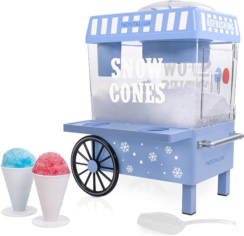 Photo 1 of ***NON-FUNCTIONAL  PARTS ONLY****
Nostalgia SCM525BL Vintage Countertop Snow Cone Maker Makes 20 Icy Treats, Includes 2 Reusable Plastic Cups & Ice Scoop – Blue
