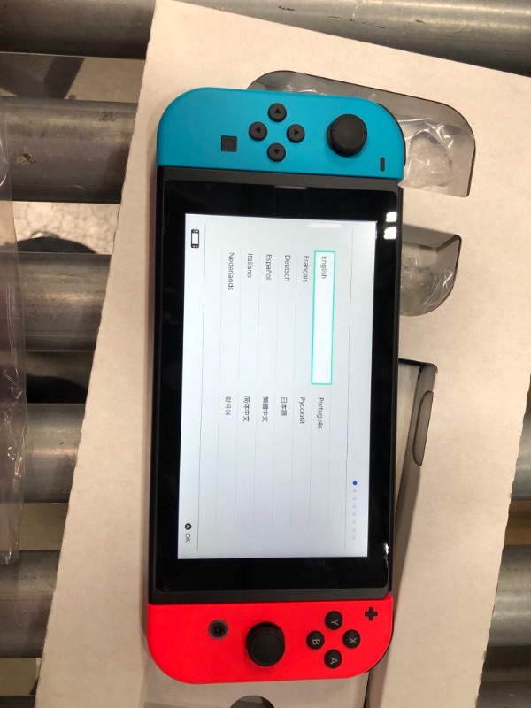 Photo 4 of Nintendo Switch with Neon Blue and Neon Red Joy-Con

