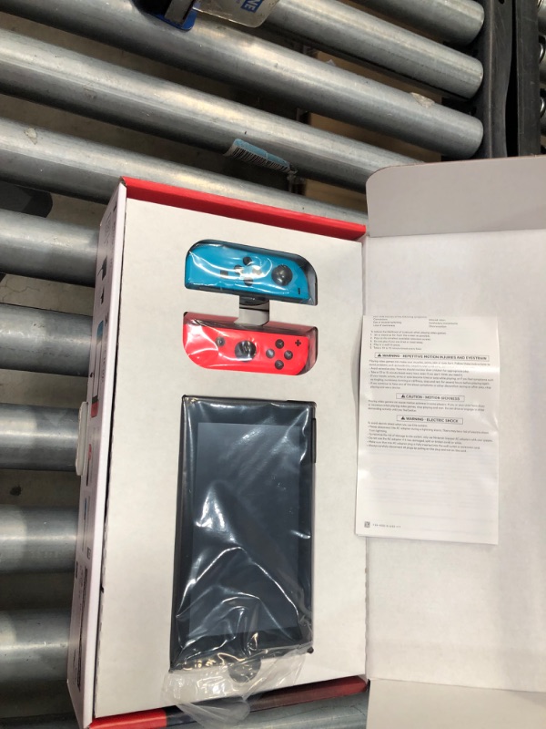 Photo 6 of Nintendo Switch with Neon Blue and Neon Red Joy-Con


