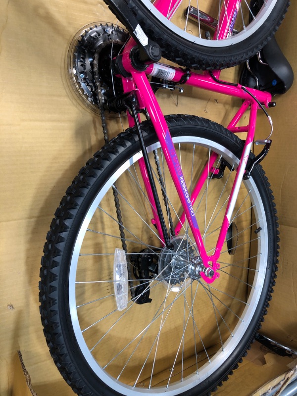 Photo 4 of Dynacraft Magna Front Shock Mountain Bike Boys, Girls, Mens and Womens 24 and 26 Inch Wheels with 18 Speed Grip Shifter and Dual Handbrakes in Red, Purple, Pink and Black
