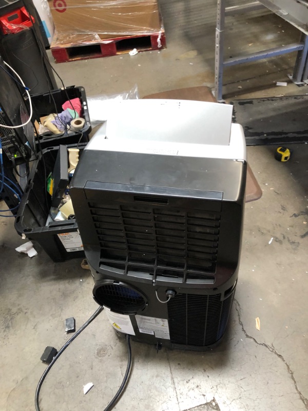 Photo 3 of PARTS ONLY NOT BLOWING COLD 
Honeywell Portable Air Conditioner w Heat Pump, Dehumidifier & Fan, Cools & Heats Rooms Up to 700 Sq. Ft. w Remote & Advanced LED Display, MN4HFS9
