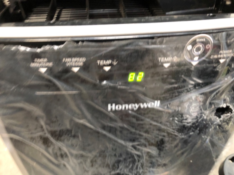 Photo 4 of PARTS ONLY NOT BLOWING COLD 
Honeywell Portable Air Conditioner w Heat Pump, Dehumidifier & Fan, Cools & Heats Rooms Up to 700 Sq. Ft. w Remote & Advanced LED Display, MN4HFS9
