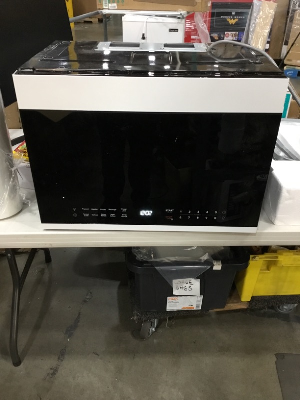 Photo 1 of Frigidaire 1.4 Cu. Ft. Compact Over-the-Range Microwave in White with Automatic Sensor Cooking

