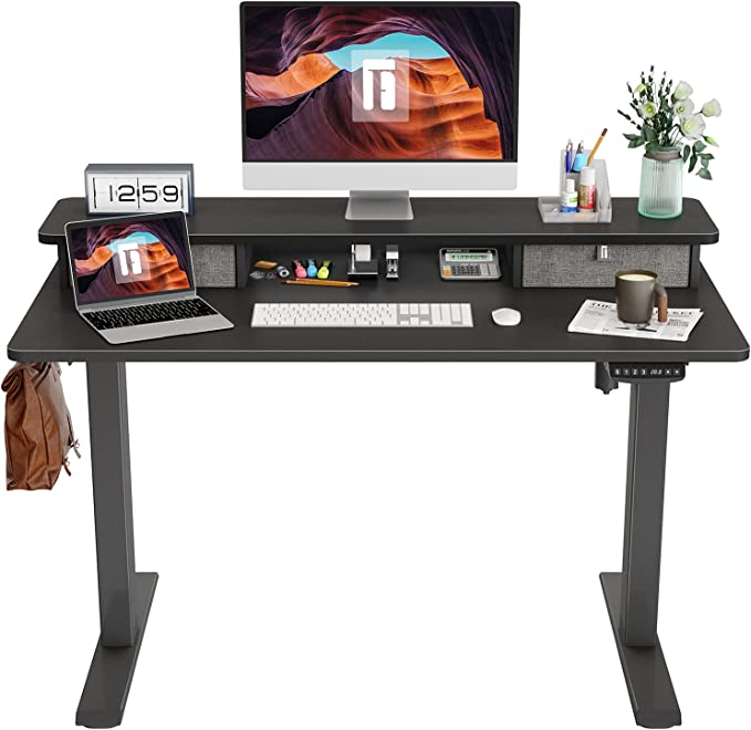 Photo 1 of FEZIBO Height Adjustable Electric Standing Desk with Double Drawer, 48 x 24 Inch Stand Up Table with Storage Shelf, Sit Stand Desk with Splice Board, Black Frame/Black Top

