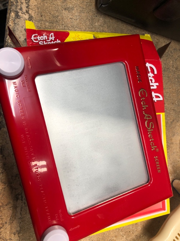 Photo 2 of Etch A Sketch, Classic Red Drawing Toy with Magic Screen, for Ages 3 and Up
