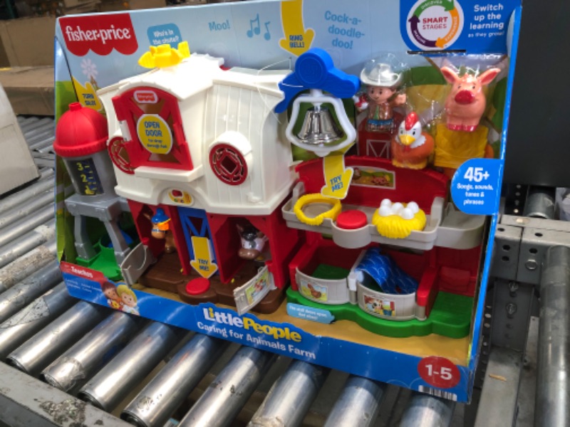 Photo 2 of Fisher-Price Little People Caring for Animals Farm Playset with Smart Stages learning content for toddlers and preschool kids
