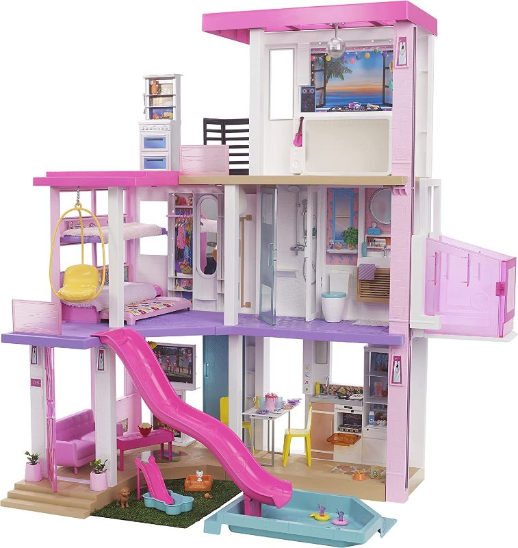 Photo 1 of Barbie Dreamhouse (3.75-ft) 3-Story Dollhouse Playset with Pool & Slide, Party Room, Elevator, Puppy Play Area, Customizable Lights & Sounds, 75+ Pieces