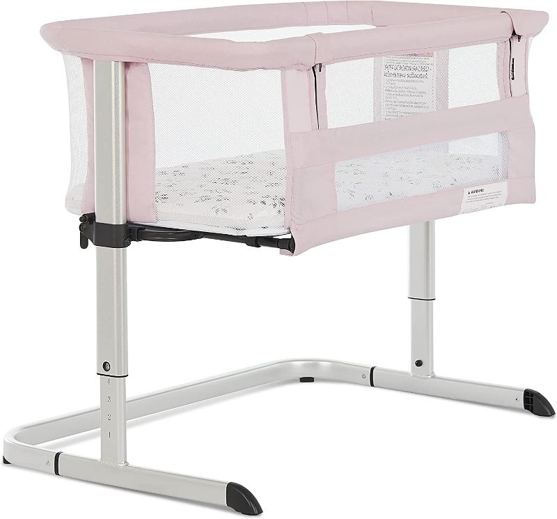 Photo 1 of Dream On Me Daisy Bassinet & Bedside Sleeper in Spring Pink/ Breathable Mesh Sides / JPMA Certified / 5 Adjustable Height Settings / Lightweight / Comes with a Carry Bag
