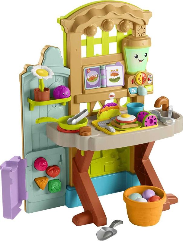 Photo 1 of Fisher-Price Laugh & Learn Grow-the-Fun Garden to Kitchen, Interactive Farm-to-Kitchen Playset for Toddlers with Music, Lights and Learning Content