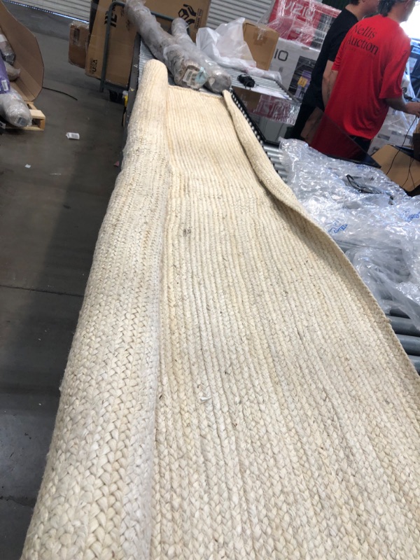 Photo 2 of **Used & needs cleaning**
 Rigo Hand Woven Jute Area Rug, 6' x 9', Off-white
