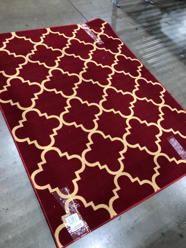 Photo 1 of ** used **
59 inch x 78 inch red and beige rug