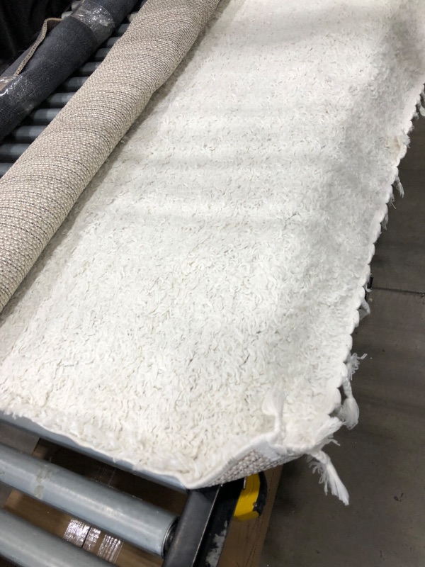 Photo 3 of ** used-need cleaning **
Neva Plush Shag Ivory 7 ft. x 9 ft. Area Rug
