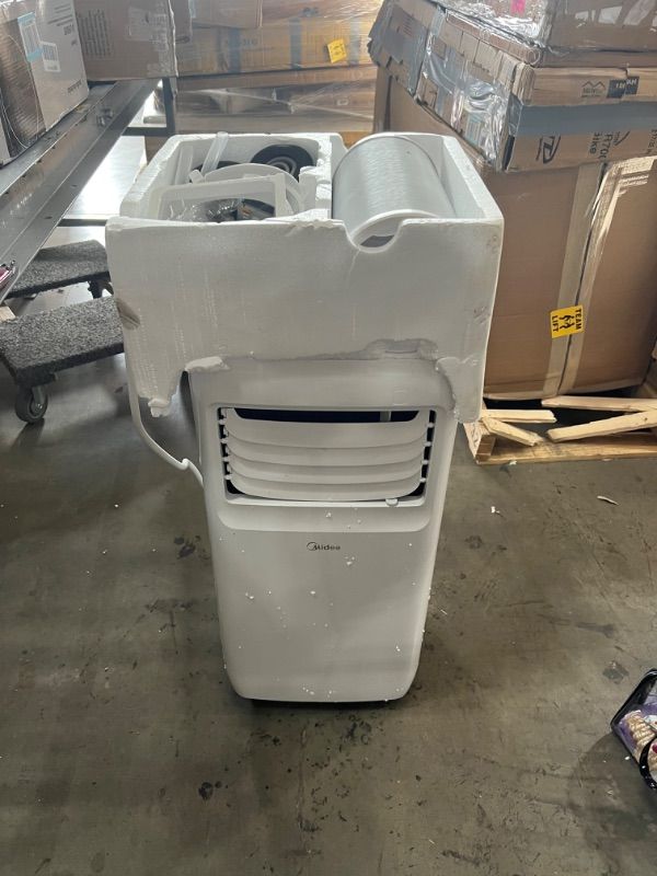 Photo 2 of **PARTS ONLY**
Midea 8,000 BTU DOE (5,300 BTU SACC) Portable Air Conditioner, Cools up to 175 Sq. Ft., Works as Dehumidifier & Fan, Remote Control & Window Kit Included
