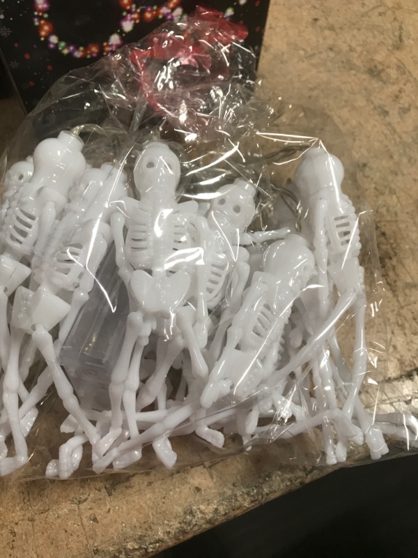 Photo 1 of 2  Halloween Lights with 20Pcs Skeleton, Battery Operated Halloween String Lights 20 LED 10ft Multicolor, 2 Modes (Flash/Steady On) Halloween Indoor Decor Fairy Light for Home Room Outdoor Decorations
