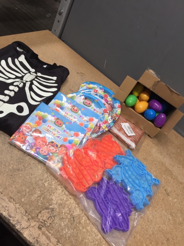 Photo 1 of *BUNDLE OF MIXED KIDS ITEMS-POPITS/EASTER EGG DINO TOYS/COCOMELON PARTY PLAT & NAPKINS/ GLOW IN THE DARK SKELETON PJS SIZE XS 4/SEATBELT COVER*  