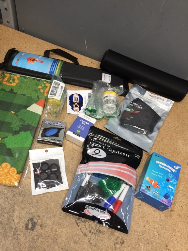 Photo 1 of *BUNDLE OF MIXED ITEMS-FACE MASK/RUBBER RINGS/SPORT GOLF PACK/FISH FOOD/STICKER/LARGE BLACK GAMER MOUSE PAD/KITE/FISH TOY/ECT. 