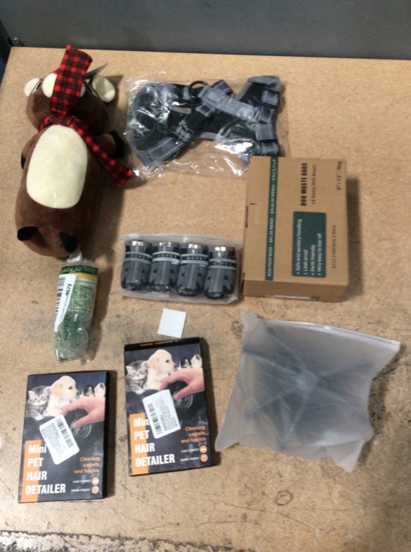 Photo 1 of **NON-REFUNDABLE** ASSORTED DOG ITEM BUNDLE- Treats (EXP 07/24), Toys, Cat and Dog Leases ands Toys, WASTE BAGS AND BOOTS 
