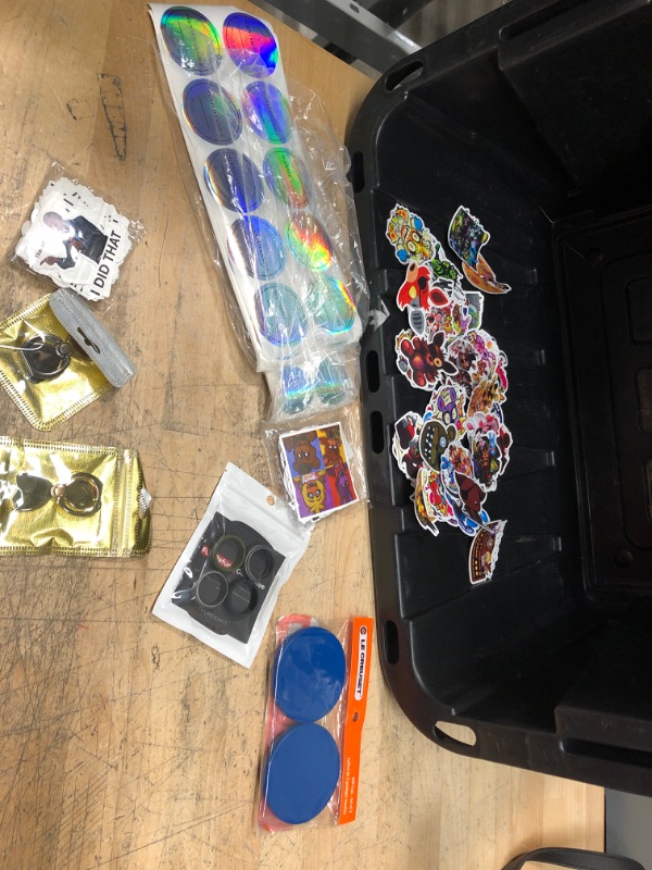 Photo 1 of **bundle of 8 items, sticker packs, rings, phone accessories